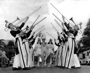 Undated: Trombones Blare for Beach Strutters. Hailing three of their strutters, the trombone section of the Miami Beach High School band sends music skyward before their appearance in the Orange Bowl festival. Strutting, from left to right, are Abby Silverstein, Robert Rocke and Connie Rothenberg.
